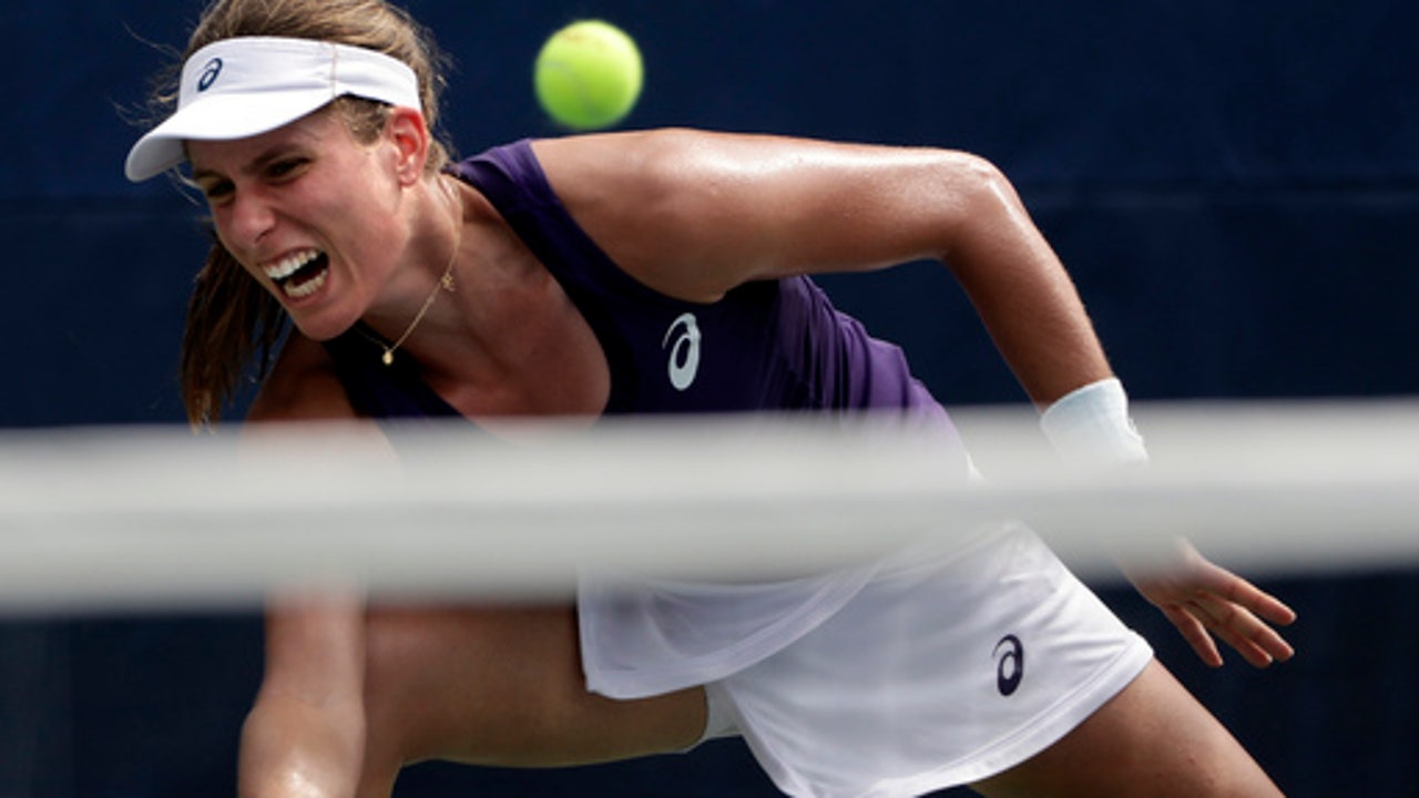 The Latest: Konta collapses on court, goes on to win match